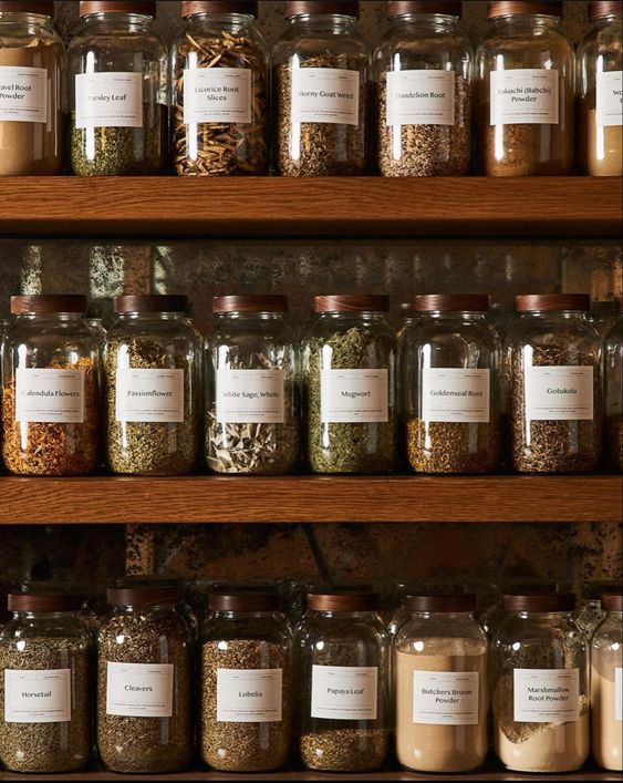 Several jars with different types of herbs.